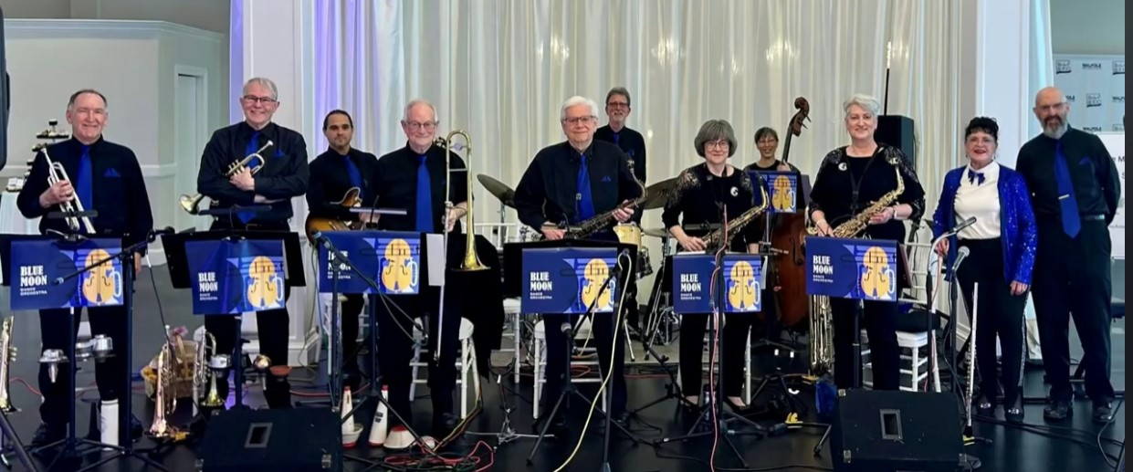 photo of orchestra standing after a performance